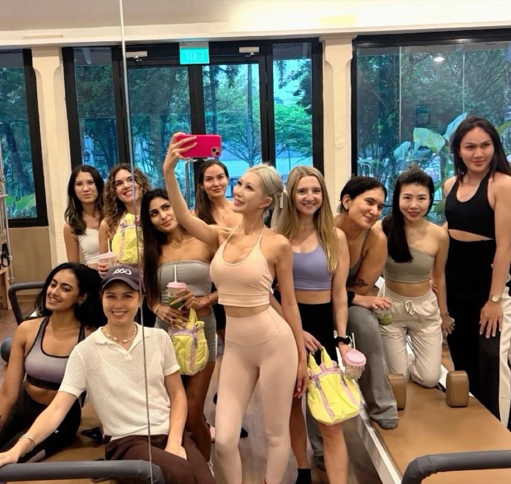 A group of women at a pilates studio holding Matcha-chan matcha drinks