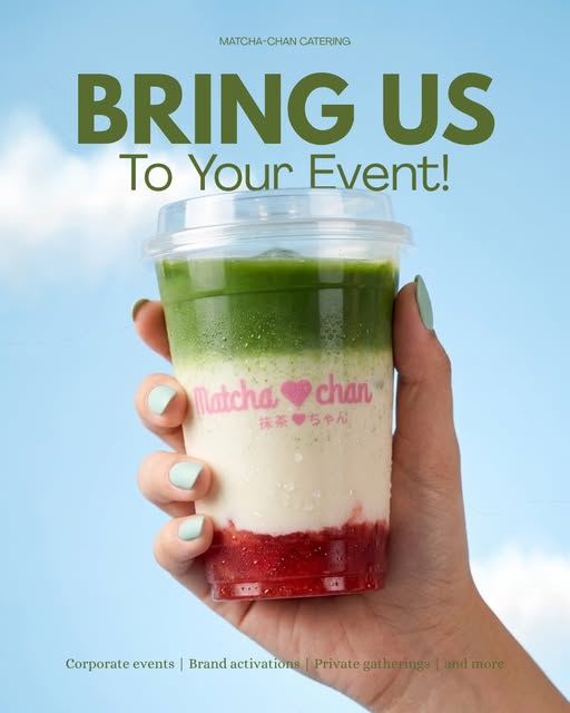 A hand holding a layered strawberry matcha against a blue sky